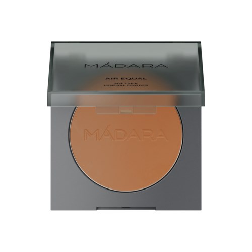 A makeup compact with a mirror and a peach-colored powder inside, labeled 'Mádara'.
