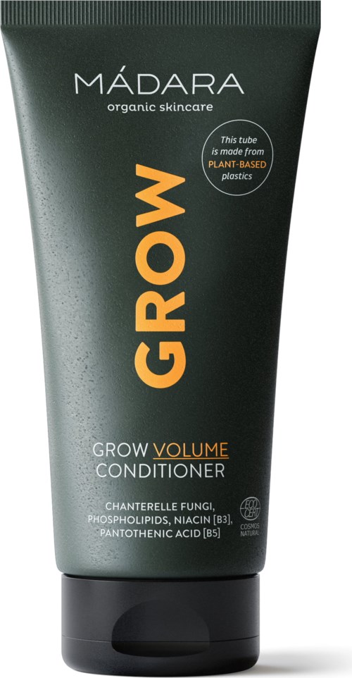 Green tube of Madara Grow Volume Conditioner with orange and white text, emphasizing organic skincare and plant-based plastics.