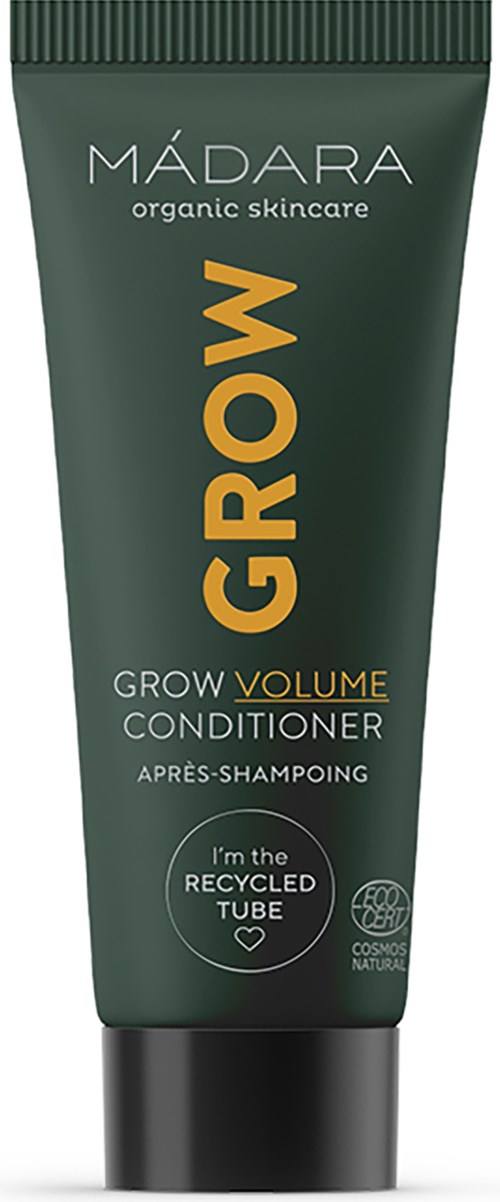 En grön tub märkt 'MADARA GROW VOLUME CONDITIONER' för hår, nämner återanvänd tub och ekologisk hudvård.