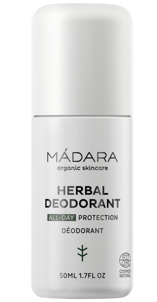 A white roll-on deodorant bottle with black and green text, labeled 'MÁDARA Herbal Deodorant, all-day protection,' and a small plant icon.