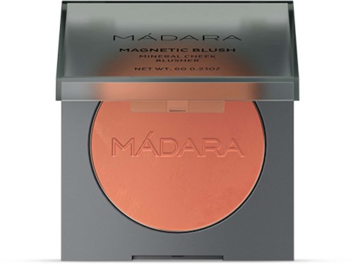 A makeup compact labeled 'Madara Magnetic Blush' with coral-colored blush inside.