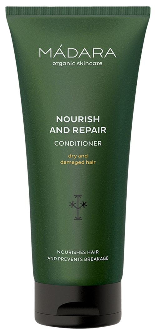 Green tube of Madara conditioner for dry, damaged hair with text about nourishing and repairing. Small logo at bottom.
