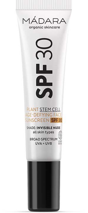 A white tube of MÁDARA SPF 30 sunscreen with black cap and text detailing its benefits for skin protection.