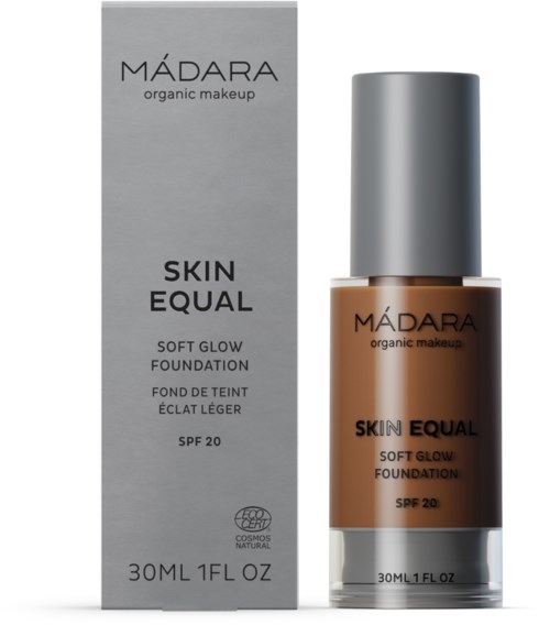 A foundation bottle with a silver cap and brown liquid, next to a grey box labeled 'MÁDARA.'