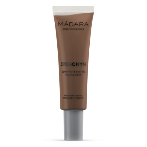 A brown tube with a silver cap, labeled 'MÁDARA organic makeup'. It mentions 'SKIN ON YIM'.