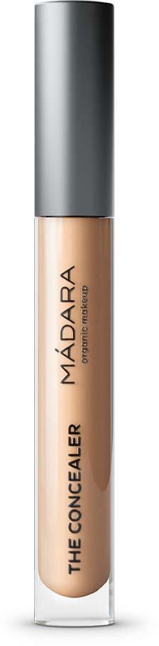 A concealer tube with a silver cap and beige liquid inside. It is from the Madara brand.