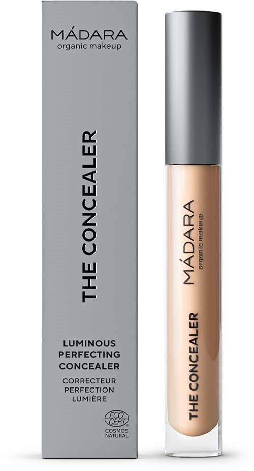 A concealer bottle and box labeled 'Madara The Concealer' with a grey cap and light beige liquid inside.
