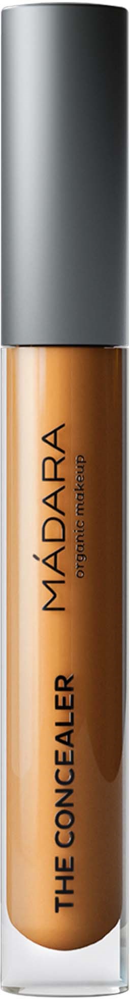 A concealer tube with a gray cap and tan liquid inside, branded MÁDARA, called The Concealer.