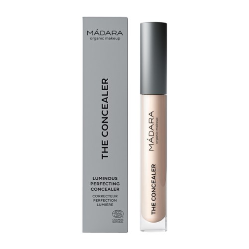 A beige concealer in a tube and a gray box with black text, indicating it is for luminous, perfecting coverage.