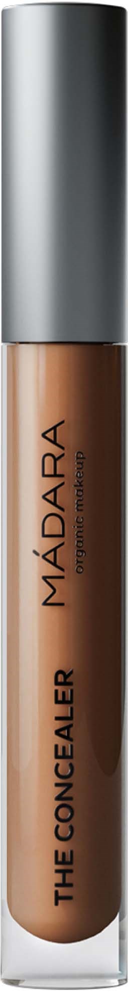 A tube of concealer with a silver cap and beige liquid inside, labeled 'MÁDARA THE CONCEALER'.