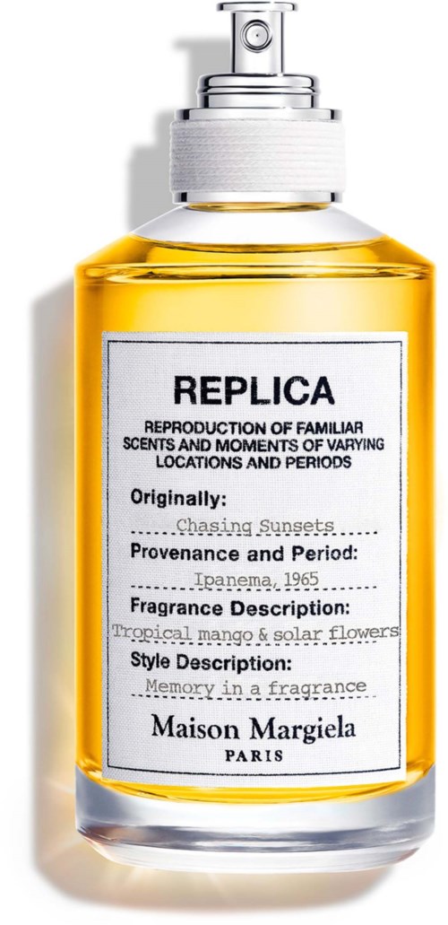 A perfume bottle labeled Replica from Maison Margiela, with yellow liquid inside and a pump top.