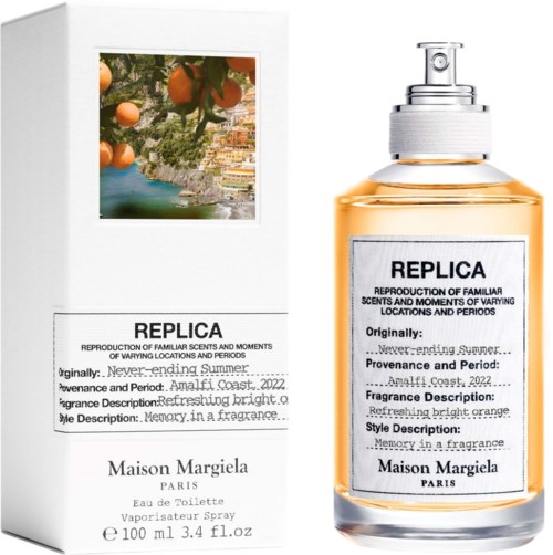 Ein Parfümflasche mit "REPLICA"-Beschriftung, orangemischung und einer weißen Verpackung mit ähnlichem Text und einem Bild von Orangen und Küste.