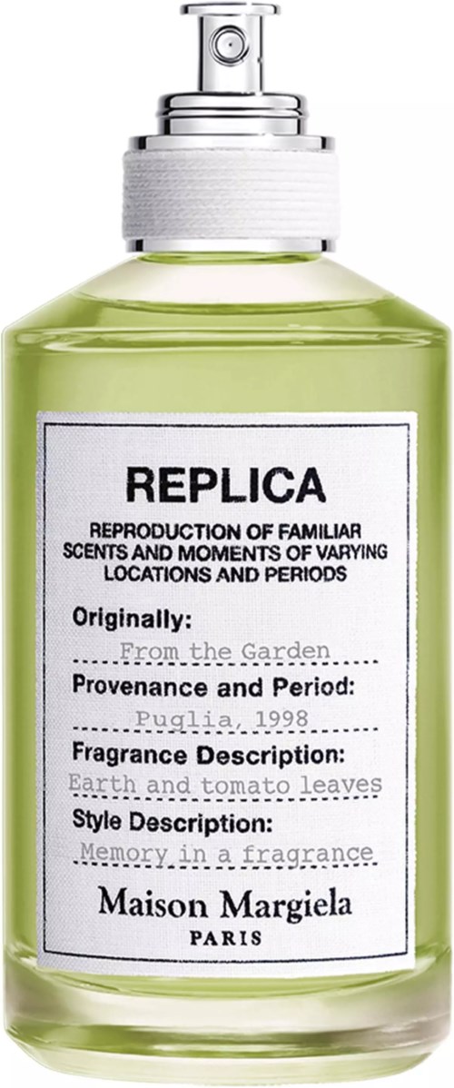 Eine grüne Parfüflasche mit Spraykopf, Marke Maison Margiela, Paris.