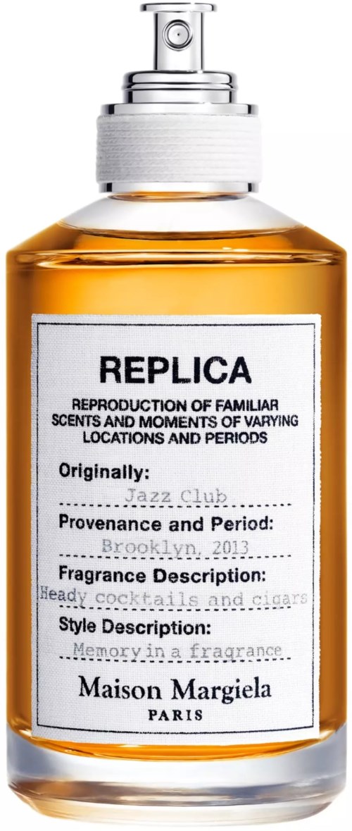 Ein Parfümflasche namens REPICA, aus Glas, mit Sprühkopf und einem Etikett mit Text. Elegantes Design.