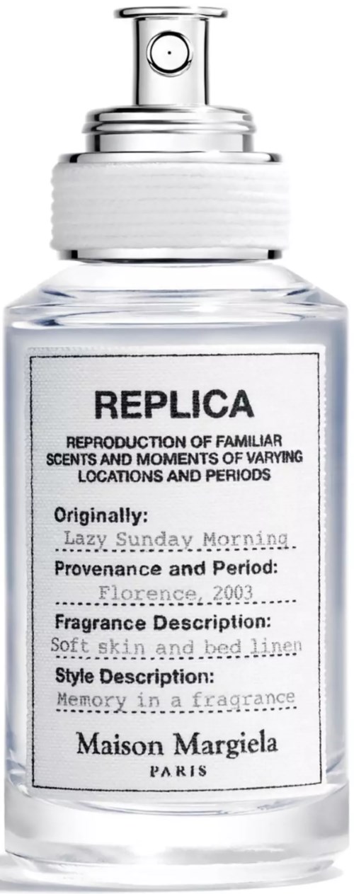 A clear perfume bottle with a spray top, labeled Replica by Maison Margiela, describing a soft, linen scent.