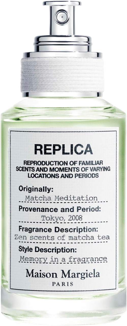 En parfymflaska märkt 'REPLICA' med uppgifter om doft, ursprung och stil från Maison Margiela.