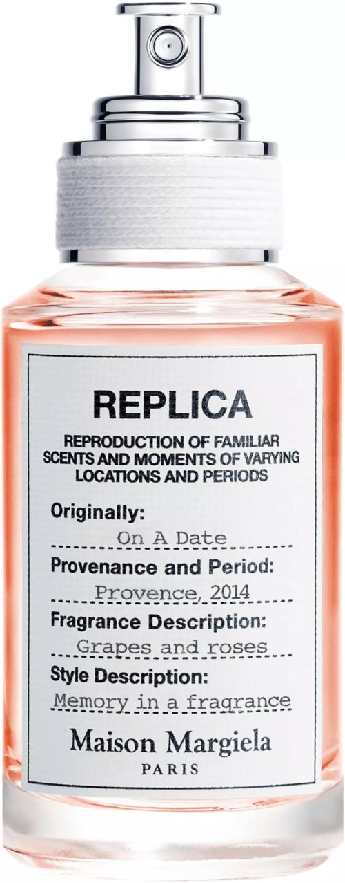 Flasche mit Sprühkopf, mit REPLICA beschriftet, enthält Duft nach Trauben und Rosen.