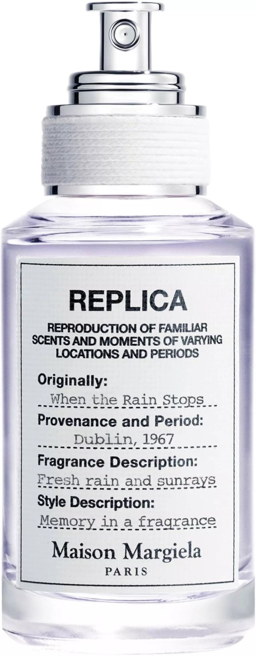 A perfume bottle labeled REPLICA with details about scent and origin, by Maison Margiela Paris.