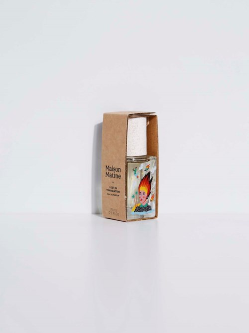 A bottle with a colorful illustration of a character inside a simple cardboard box.