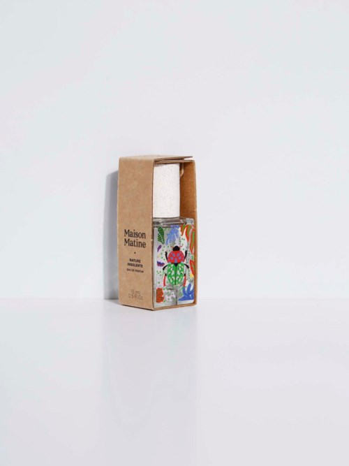 A small bottle inside a cardboard box with colorful artwork, labeled 'Maison Matine'.