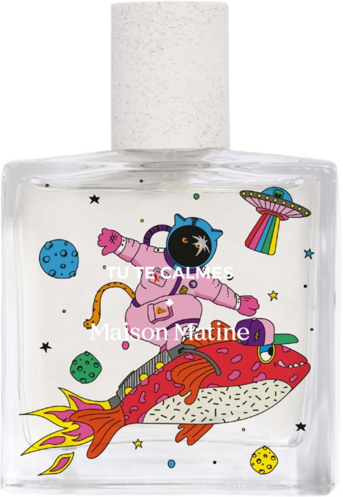 A clear perfume bottle with colorful cartoon space-themed illustrations, including a smiling black cat in a pink space suit riding a fish.