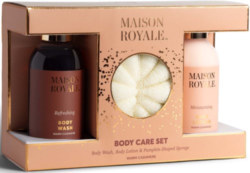 A gift set includes body wash, body lotion, and a pumpkin-shaped sponge, all in warm cashmere scent. The packaging is pink and gold.