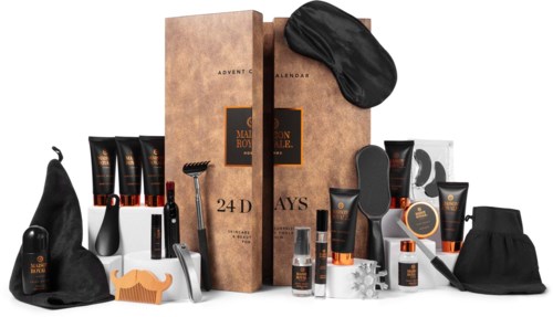 En herrars grooming-sats med olika svarta och orange toalettflaskor, borstar och tillbehör, presenterade i en box.