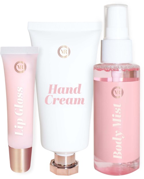 A set of pink and white cosmetic tubes and spray bottle, labeled for lips, hands, and body mist.