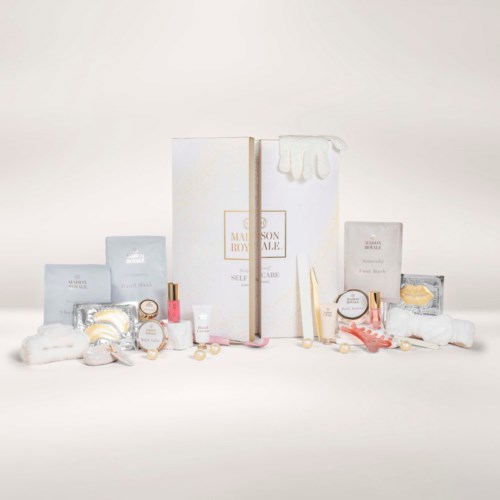 Various skincare and beauty products including jars, bottles, and packaged items, displayed with a large white box in the center.