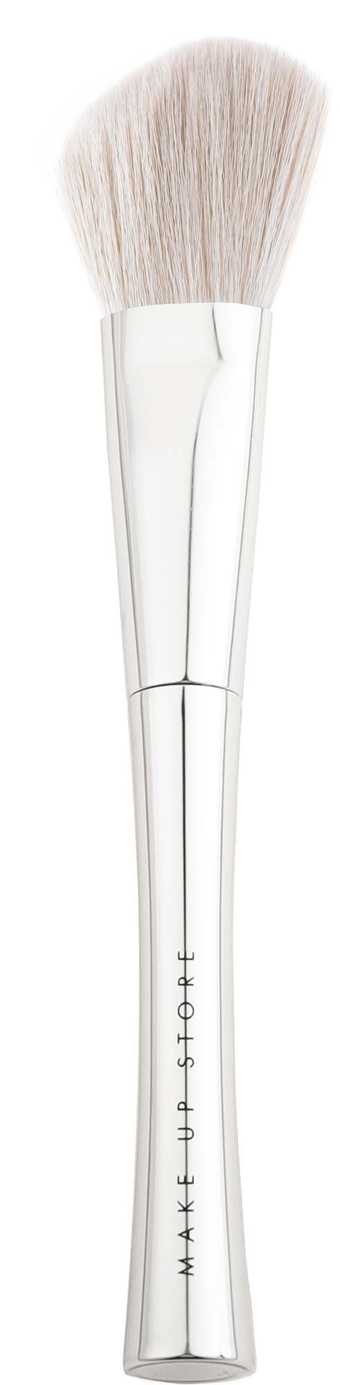 A white makeup brush with soft bristles and a silver handle that has the brand name on it.
