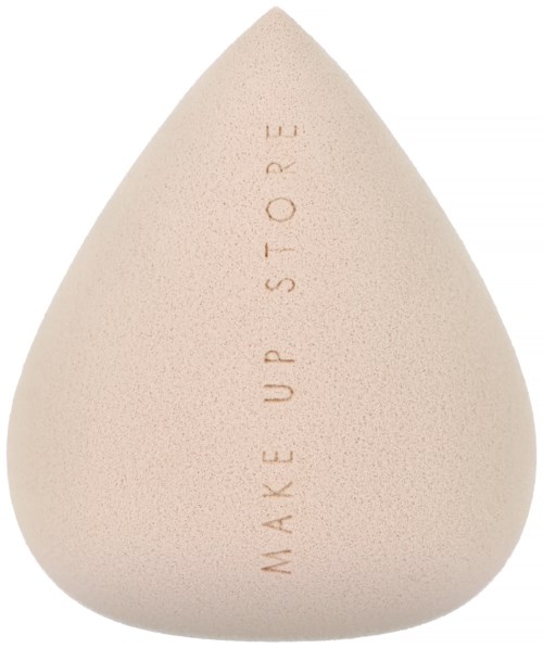 A beige beauty sponge with the words 'MAKE UP STORE' written on it.