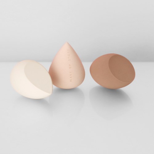 Three eggs: one broken, one whole, one shell empty, with neutral background.