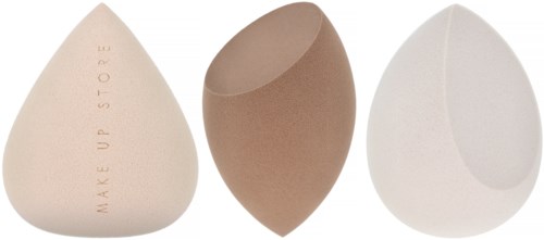 Three egg-shaped objects: one with text, one plain brown, and one white with a curved cut.