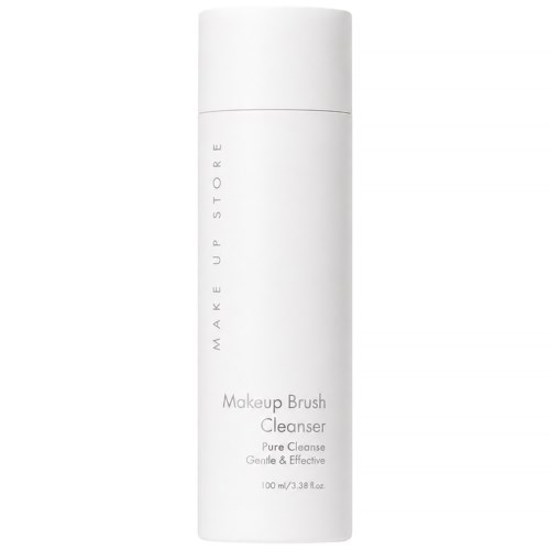 En vit, cylindrisk flaska med lock, märkt Makeup Brush Cleanser, 100 ml, för skonsam och effektiv rengöring.