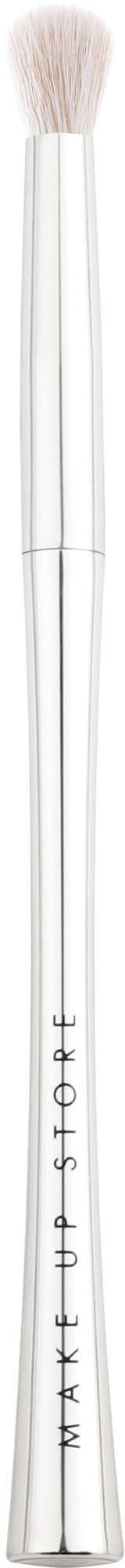 A long, white makeup brush with soft bristles and a silver handle. The words Max Factor are written on the handle.