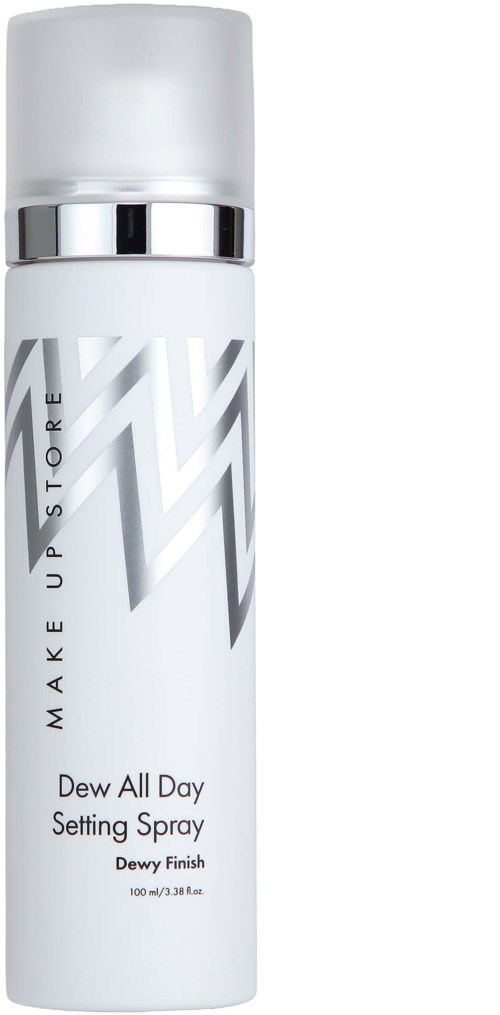 A white spray bottle with silver details and zigzag design, labeled Dewy Finish setting spray.