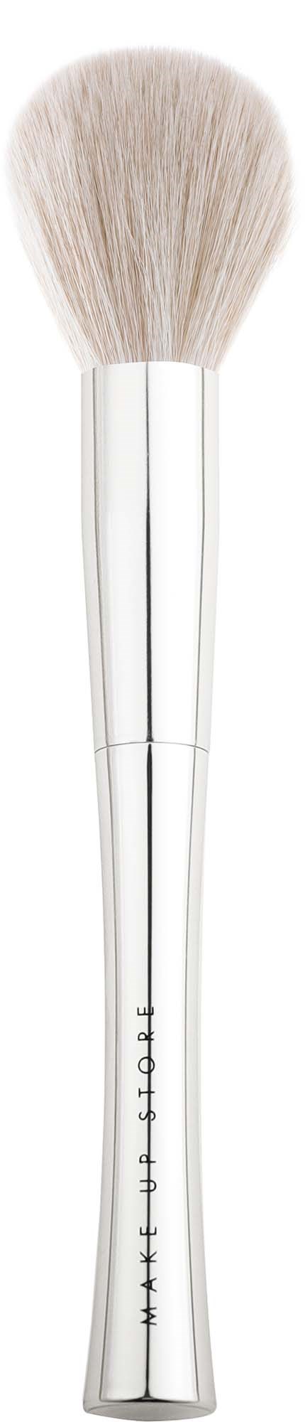 A white makeup brush with a clear handle and soft bristles. It has a slight curve in the handle.