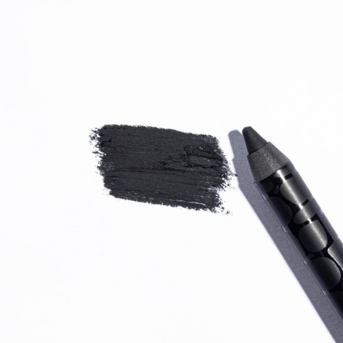 Een zwarte marker tekent een dikke streep op wit papier.