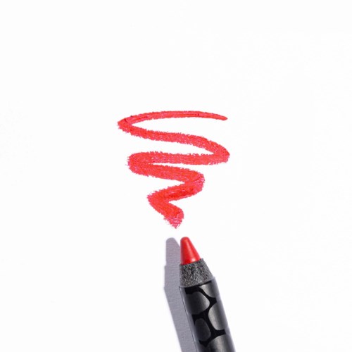 En röd marker ritar ett spiralmönster på vitt papper.