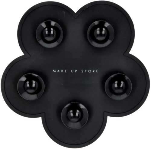 En svart blommformad sminkborsthållare med fem runda fack och orden 'MAKE UP STORE' i mitten.