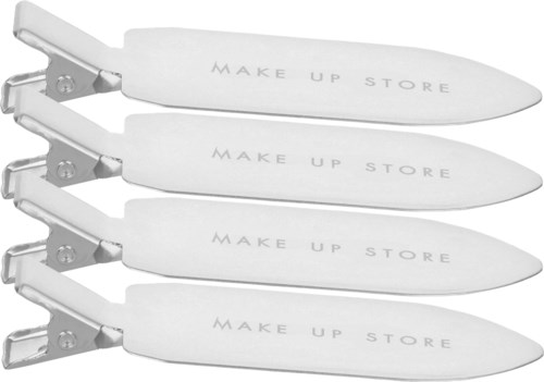Vier witte spatels met de woorden "MAKE UP STORE" erop, gestapeld.