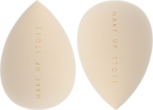Two makeup sponges with the phrase "MAKE UP STORE" written on them, beige color, teardrop shape.
