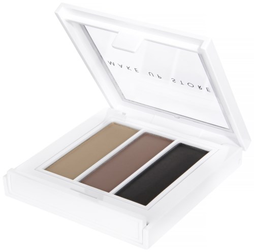 Een witte doos met drie make-uppentinten: beige, bruin en zwart, binnenin. De binnenkant van het deksel heeft tekst.