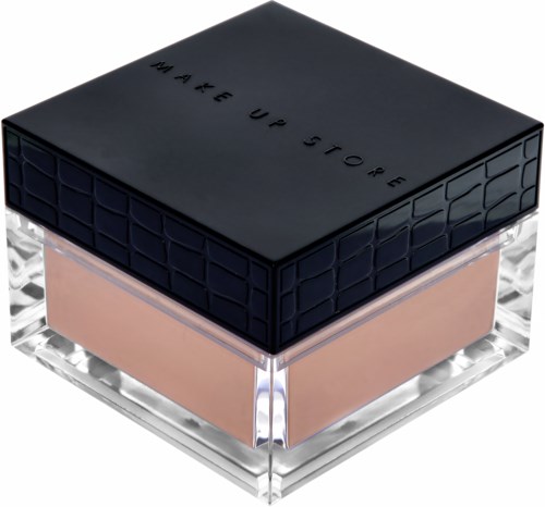 En makeupprodukt i en genomskinlig behållare med svart lock och beige puder inuti.