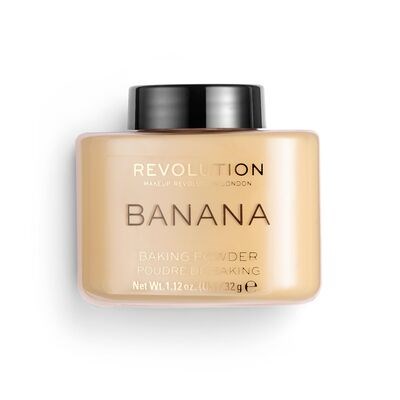 Een beige pot met zwarte deksel, met label "Revolution London Banana Baking Powder for Baking."