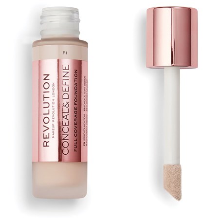 Roze foundationfles met sponsapplicator en roségouden deksel.