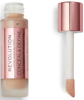 A bottle of Revolution concealer with a pink cap and an applicator with a sponge tip.