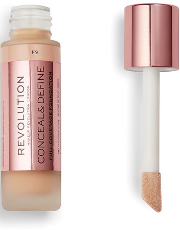 A bottle of liquid foundation with a wand applicator beside it, both in pinkish tones.