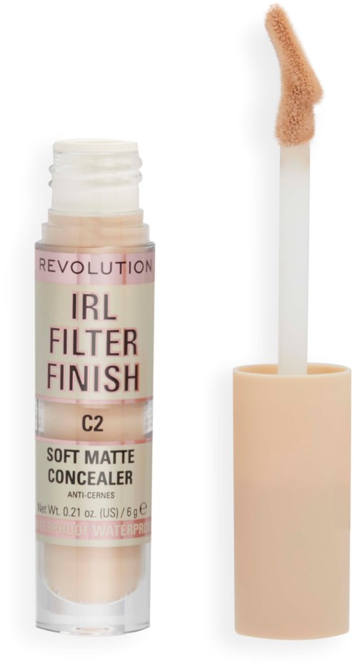 Ett concealer-rör märkt 'IRL FILTER FINISH' med en öppen applikator som visar beige produkt.