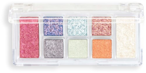 A small, clear makeup palette with eight different glittery eyeshadows in various colors.